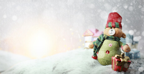 Happy  teddy bear with xmas presents on sunny winter day.Merry Christmas and happy new year concept background.