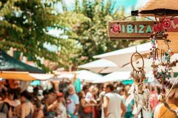 Market outside in Ibiza with a wooden sing that says ibiza on a sunny day - obrazy, fototapety, plakaty