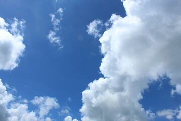 Clear blue sky and white floating cloud on a bright day.