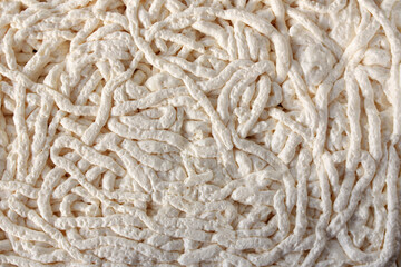 Background white mounting foam. Horizontal photo. Texture of polyurethane foam for wall insulation.Construction foam background. 