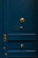 Blue door with bronze details