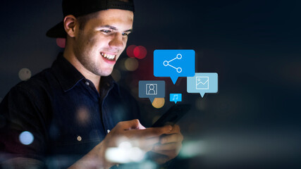 Man using his phone in the dark