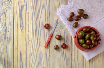 Varietal tomatoes on a wooden background