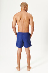 Man in swimming shorts blue board shorts