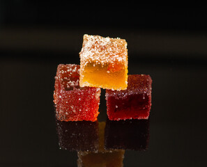 Fruit marmalade on a mirror surface.