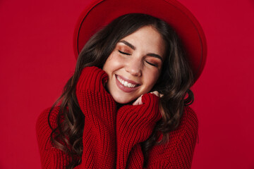 Joyful beautiful brunette girl posing and smiling at camera