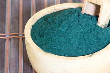 Organic spirulina algae powder in a bowl