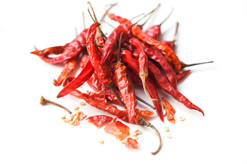 Dried chili on white background - pile of red dried chilli pepper cayenne