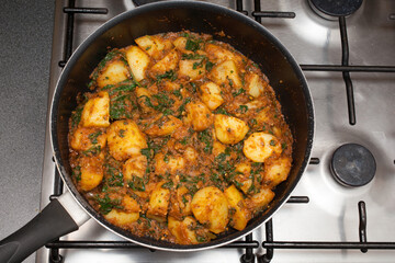 A homemade Sag Aloo, a spicy Indian potato and spinach dish