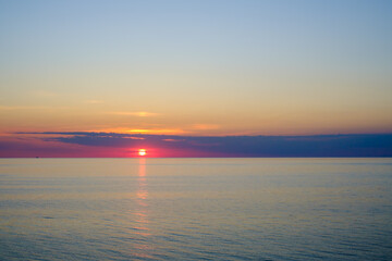 Sea water against sundown sky