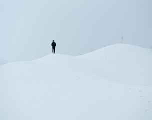 man stands on top of a snowy white mountain in Nepal, Makalu National Park