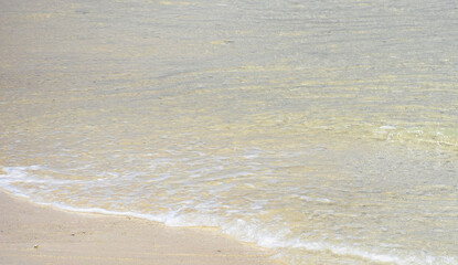 Fototapeta na wymiar Small waves on the beach