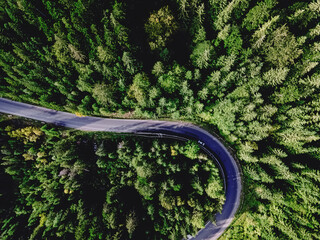 Aerial top view of curvy mountain road