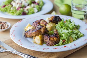 Grilled or roasted spicy chicken wings with bbq sauce