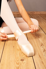 young ballerina tying her ballet slippers © xavier gallego morel