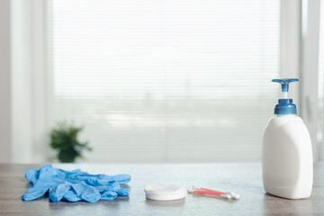 Protective equipment set: antibacterial soap, medical gloves, cotton pads and buds, personal device sanitization reminder