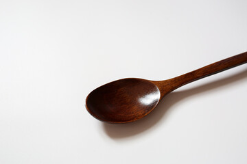 wooden spoon on white background