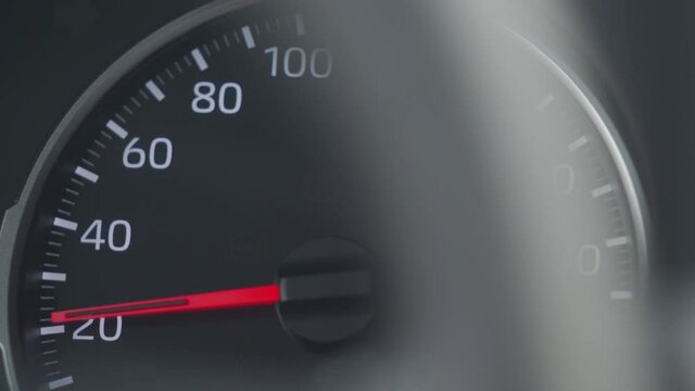Car tachometer and moving pointer, car dashboard panel detail closeup. High quality 4k footage