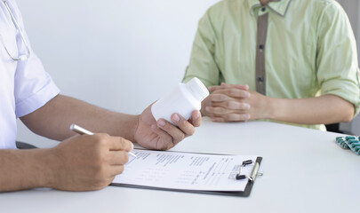 Doctor is advising patients in a hospital diagnostic room.
