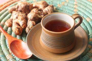 Top view of ginger tea on wooden background.