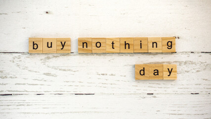 Buy Nothing Day.words from wooden cubes with letters photo