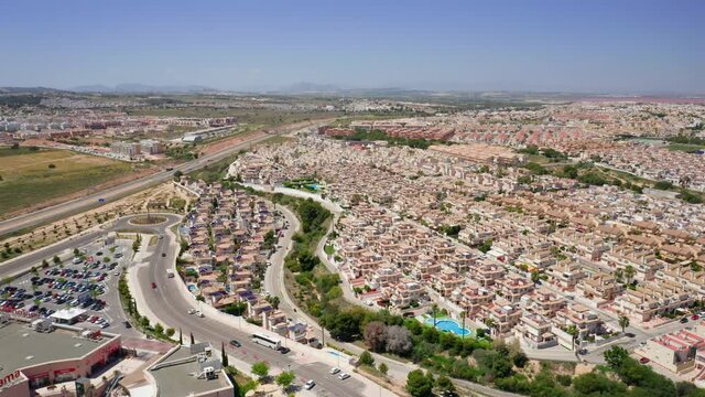 Housing estates in La Zenia, Alicante, Spain. Aerial showing rows of houses, big neighborhoods during summer sunny day.