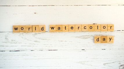 World Watercolor Day.words from wooden cubes with letters photo