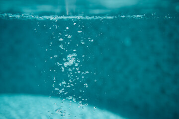 Air bubbles in water in swimming pool