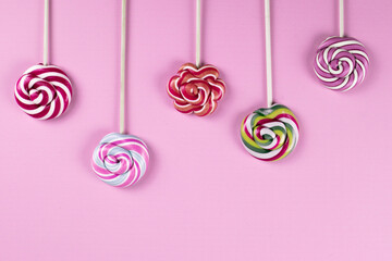 colourful lollipops on the pink background