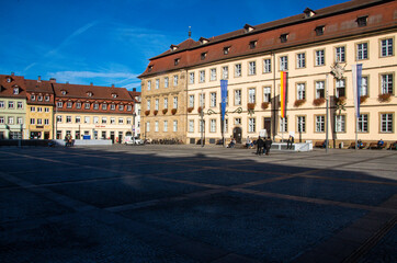 View of the sunlit facade of the town hall on Maxplatz in the World Heritage city of Bamberg. High quality photo. Copy Space for characters or letters.