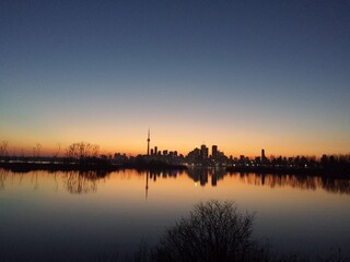 Toronto supercity during the sunset. Appears as a silhouette in background.