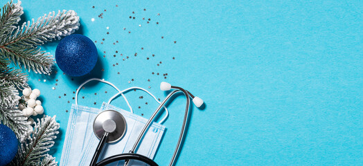 Christmas medical banner with festive sparkling decorations, fir tree branches. protective facial...