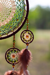 Handmade dream catcher with feathers threads and beads rope hanging