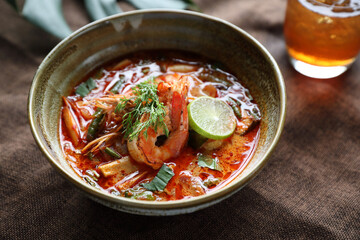 Tom Yum soup , a Thai traditional spicy prawn soup