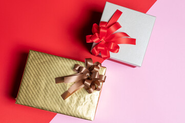 the Christmas gifts laying on the color backdrop