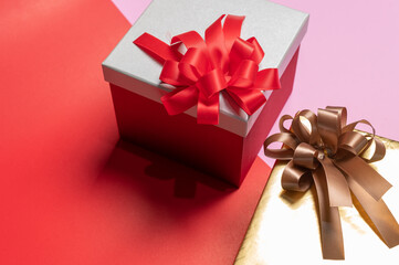 the Christmas gifts laying on the color backdrop