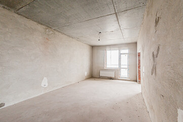 Russia, Moscow- April 17, 2020: interior room apartment rough repair for self-finishing. interior decoration, bare walls of the premises, stage of construction