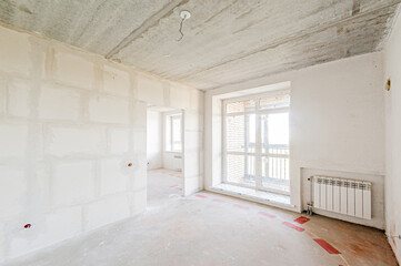 Russia, Moscow- April 17, 2020: interior room apartment rough repair for self-finishing. interior decoration, bare walls of the premises, stage of construction