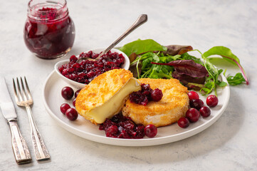 Fried camembert cheese and cranberry sauce.
