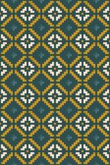 Geometric ornament of rhombuses and flowers in the native American style on green background. Seamless pattern for web, print, textile, wallpaper, card, wrapping paper and background