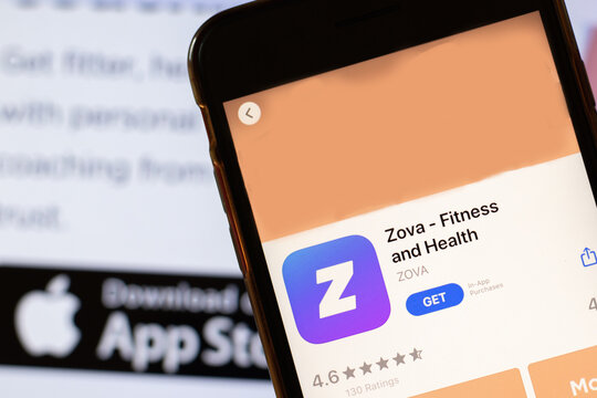Los Angeles, California, USA - 24 March 2020: Zova app logo on phone screen close up with website on background with icon, Illustrative Editorial