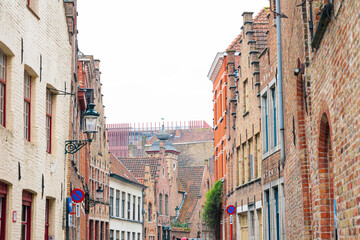 Obraz premium BRUGES, BELGIUM - April 13, 2018: Antique building view in Old Town Bruges, Belgium