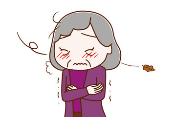 北風が冷たく寒さにブルブル震える高齢の女性