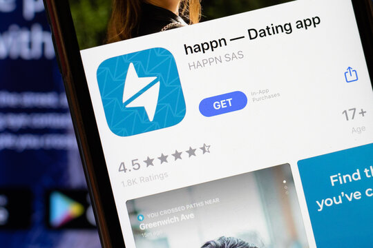 Los Angeles, California, USA - 24 March 2020: happn Dating app logo on phone screen close up with website on background with icon, Illustrative Editorial
