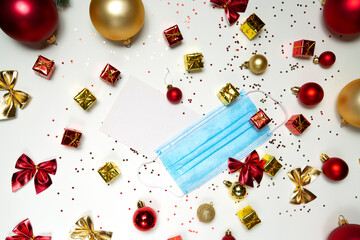 Christmas decorations  and a medical mask. coronavirus and quarantine theme