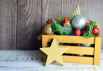 Christmas decorations in a wooden box, preparing for these special and family days. Merry Christmas.