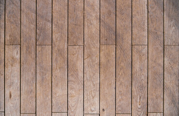 Texture of natural wooden brown table from vertical planks as background