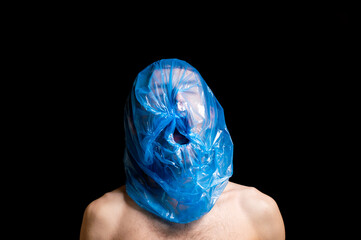 portrait strangulation, plastic bag on head - 393347763
