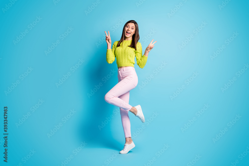 Sticker full body photo of young positive smile woman show v-sign peace hi isolated over blue color backgrou