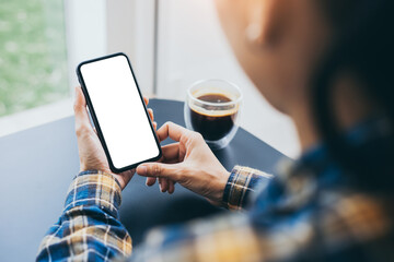 cell phone blank white screen mockup.woman hand holding texting using mobile on desk at office.background empty space for advertise.work people contact marketing business,technology